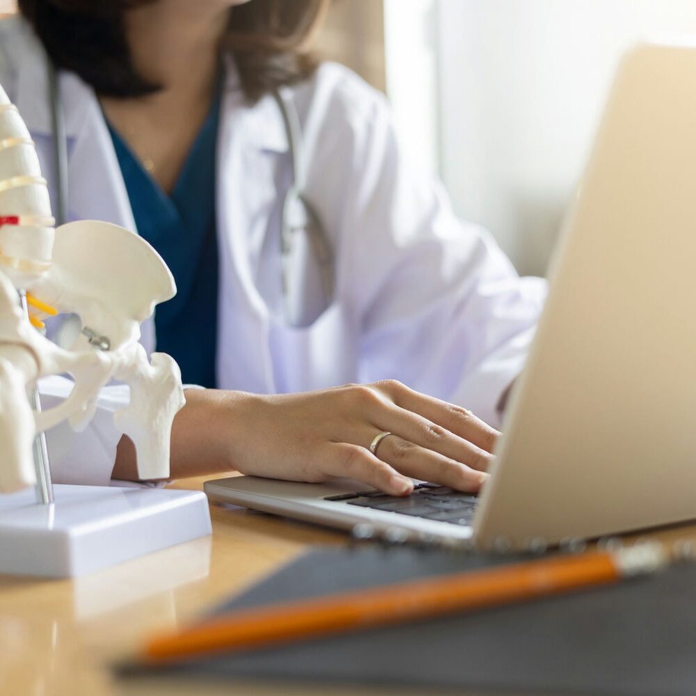 Clinician documenting care coordination and planning as part of post-assessment support services