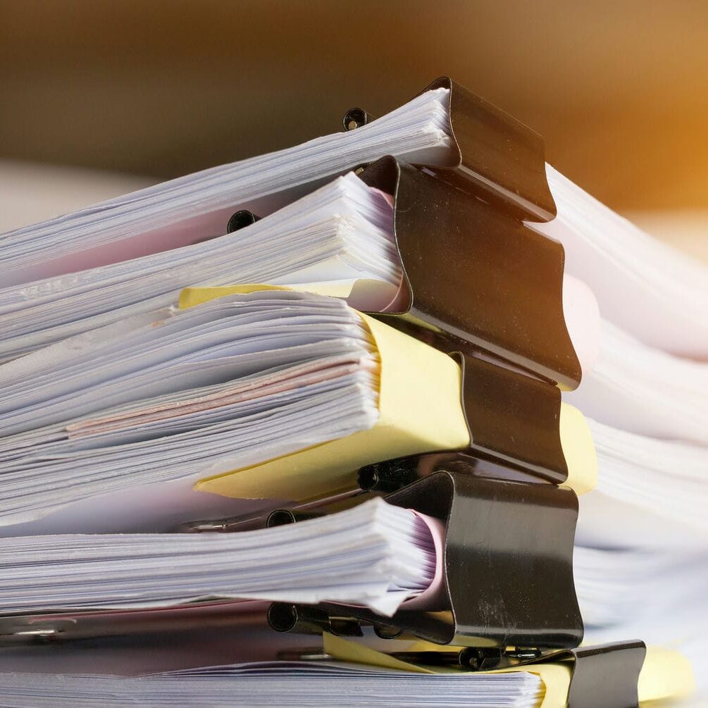 Organized medical assessment files representing review and coordination of evaluation requests