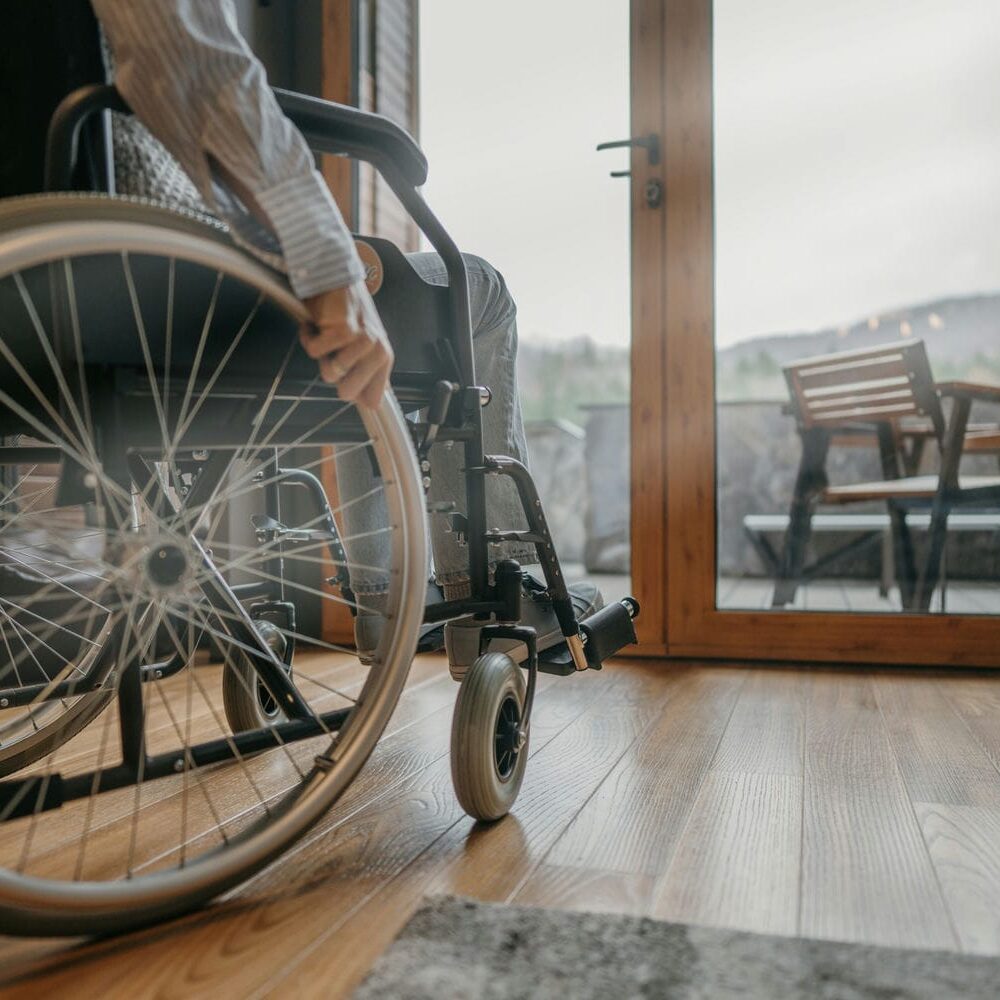 Wheelchair user navigating a home environment during a functional and daily living assessment